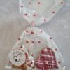 Love Bites Valentine Dog Treats Gift Bag | Bow Wow Box UK Valentine dog treats UK Love Bites gift bag with heart-shaped cookies in cellophane with red hearts from Bow Wow Box Artisan Dog Bakery
