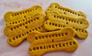 Bone-shaped dog treats custom-branded with "BowWowBox & Lorraine Tester," a bespoke wholesale order from Bow Wow Box